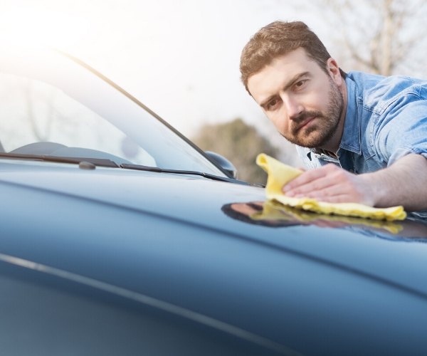 guy waxing car