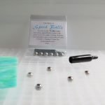 Creator's Speed Balls and removal tool on a waffle grid with stained glass Mountain Woman Products