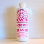 Novacan Super Brite Copper Patina for Stained Glass Solder in front of glass Mountain Woman Products