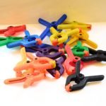 collection of spring clamps for holding stained glass while soldering in all different colors Mountain Woman Products