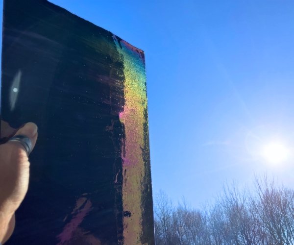 Designer Glass Iridized Purple in the sun with tree silhouettes in the background Mountain Woman Products