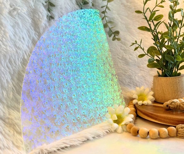 Dichroic Florentine Rainbow 1 Thin on Clear Glass with a plant beads and a fur and iridescent background Mountain Woman Products