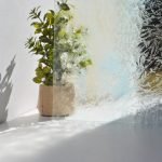 Glue Chip Clear Stained Glass Sheet in front of plant to show opacity Mountain Woman Products