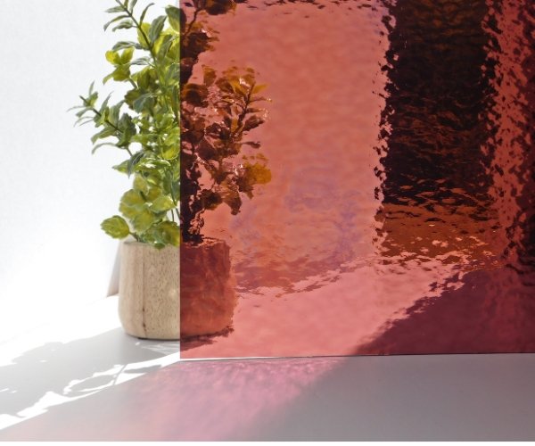 Oceanside 96-05-142 Light Purple Rough Rolled Stained Glass sheet in front of a plant to show cathedral opacity Mountain Woman Products