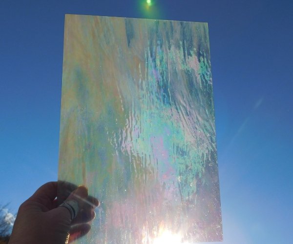 Wissmach grey & white prisma luminescent glass 96 coe with the sun shining through Mountain Woman Products stained glass
