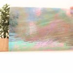 Wissmach Grey & White Prisma Luminescent Glass 96 coe 96-60 with a plant behind it to show transparency Mountain Woman Products