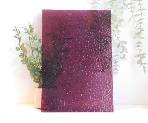 Wissmach Wine English Muffle Stained Glass Sheet EM241 purple red wine colored cathedral glass in front of a plant to show opacity on a white background Mountain Woman Products
