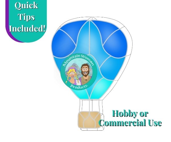 Hot air balloon stained glass pattern with ombre colors of blue to aqua and beige basket Mountain Woman Products logo