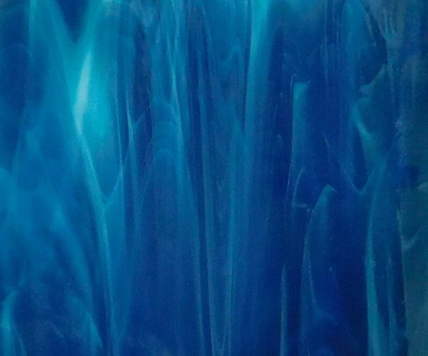 Oceanside Deep Aqua White Wispy Stained Glass Sheet is a darker blue color with white streaks Mountain Woman Products