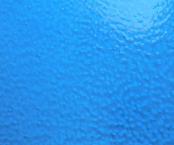 Wissmach Light Blue Corella Classic Stained Glass Sheet closeup showing bumpy texture Mountain Woman Products