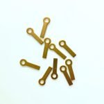 Handy hangers closeup picture showing brass hangers for stained glass that have an eye and a long tail