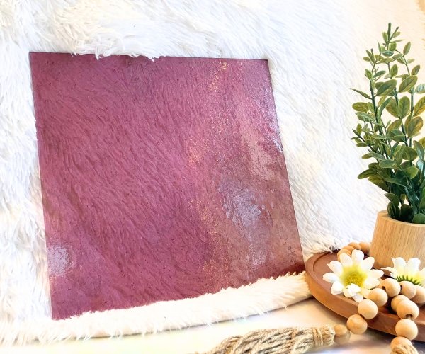Wissmach Pale Rose Seedy Stained Glass Sheet with a white background and a plant with daisies in the Mountain Woman Products studio