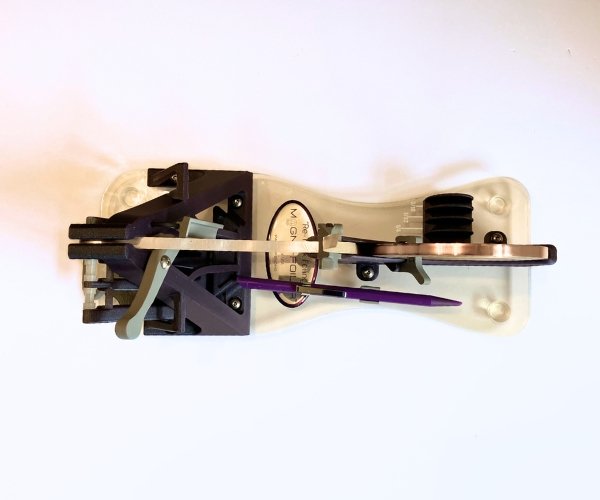 Creators Magne-Foiler purple machine with stained glass foil loaded in it top view Mountain Woman Products