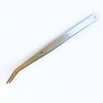 glass tweezers in stainless steel on white background mountain woman products