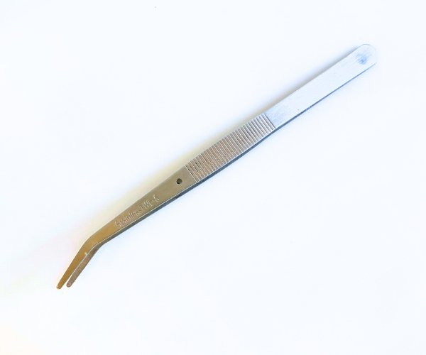glass tweezers in stainless steel on white background mountain woman products