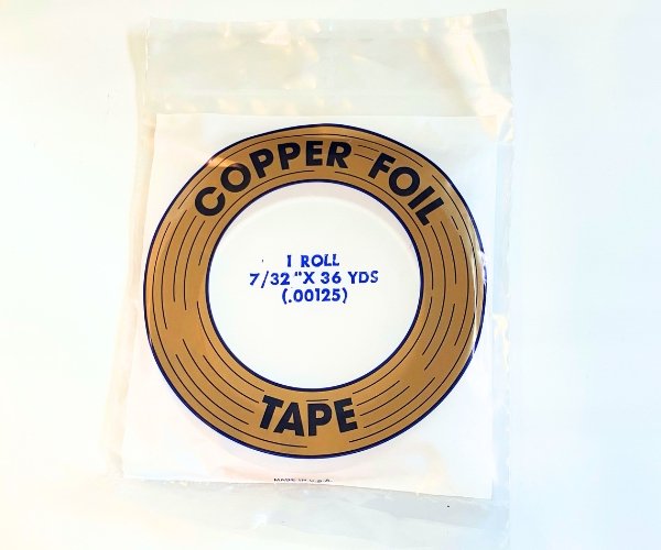 Edco 7/32" Copper Back copper foil tape in a clear bag with blue lettering in Mountain Woman Products studio