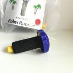 Creators Palm Runner for running scores and breaking stained glass in black with a purple round handle and a yellow nubbin tip in the Mountain Woman Products stained glass studio