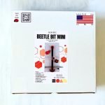 Creator's Beetle Bits Mini Glass Cutting System showing white box with red and black picture of a straight line guide cutter and accessories Mountain Woman Products