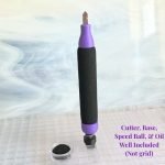 Creator's Cozy Cutter for Glass upright in purple and black attached to a magnetic base that fits in a waffle grid showing oil well too in the Mountain Woman Products studio