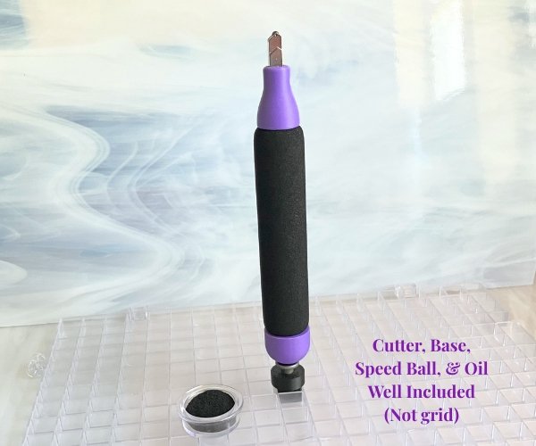 Creator's Cozy Cutter for Glass upright in purple and black attached to a magnetic base that fits in a waffle grid showing oil well too in the Mountain Woman Products studio