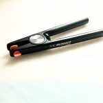 The Runner by Techniglass Running Pliers for stained glass showing black aluminum handles and body and orange adjustable top jaw in the Mountain Woman Products studio