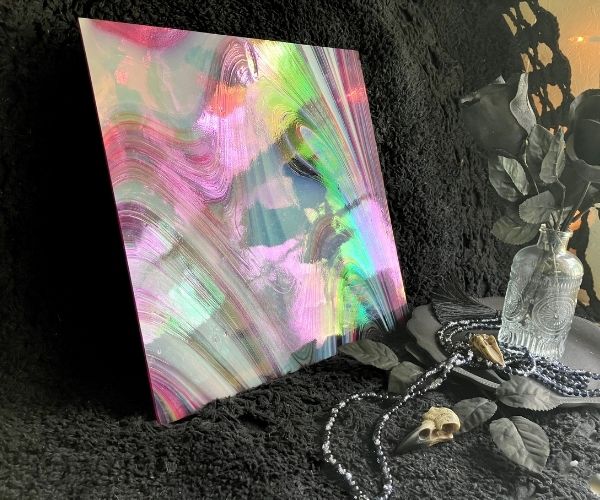 Oceanside Witching Hour Fuser's Reserve Special Edition Stained Glass Sheet red and white swirly opal and wispy glass with rainbow iridizing against a black background in the Mountain Woman Products studio