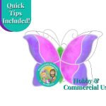Beginner butterfly stained glass pattern showing colored version with purple and pink wings with a green body and the mountain woman products logo