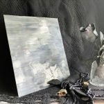 Designer Glass Medium Grey & White Opal sheet with grey and white streaks in front of a black background at the mountain woman products studio