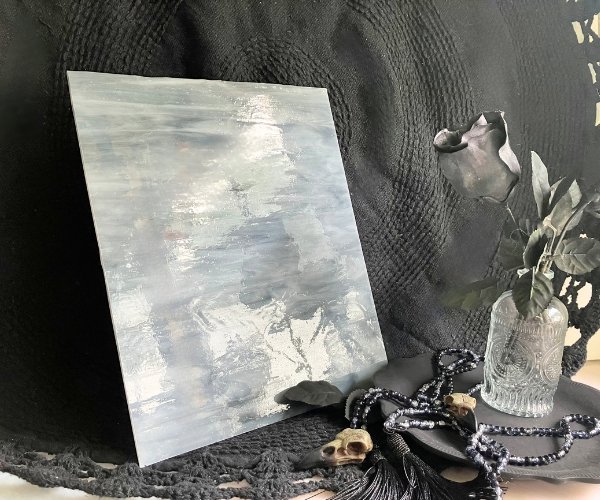 Designer Glass Medium Grey & White Opal sheet with grey and white streaks in front of a black background at the mountain woman products studio