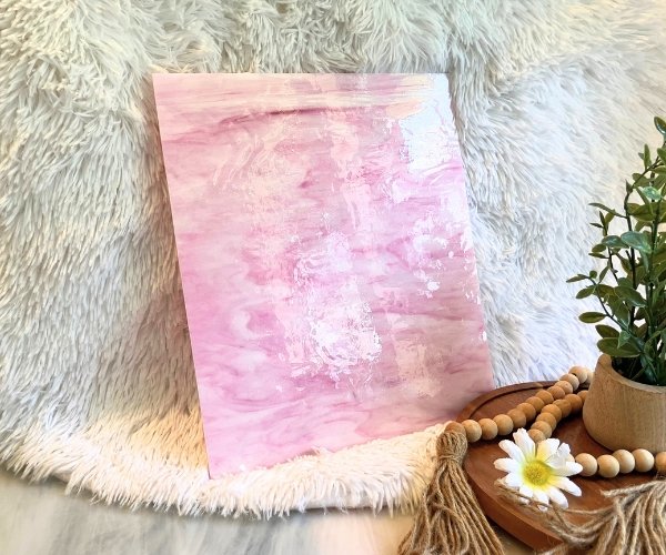 Designer Glass Pink & White Fusible Stained Glass Sheet in a bubble gum pink type color with a white background and a plant in the Mountain Woman