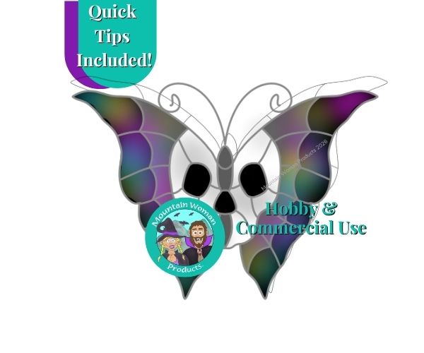 halloween skull butterfly stained glass pattern showing white skull inside and black and grey spiderwebbed butterfly body outside with the mountain woman products logo dressed up for halloween with a witch hat and a vampire